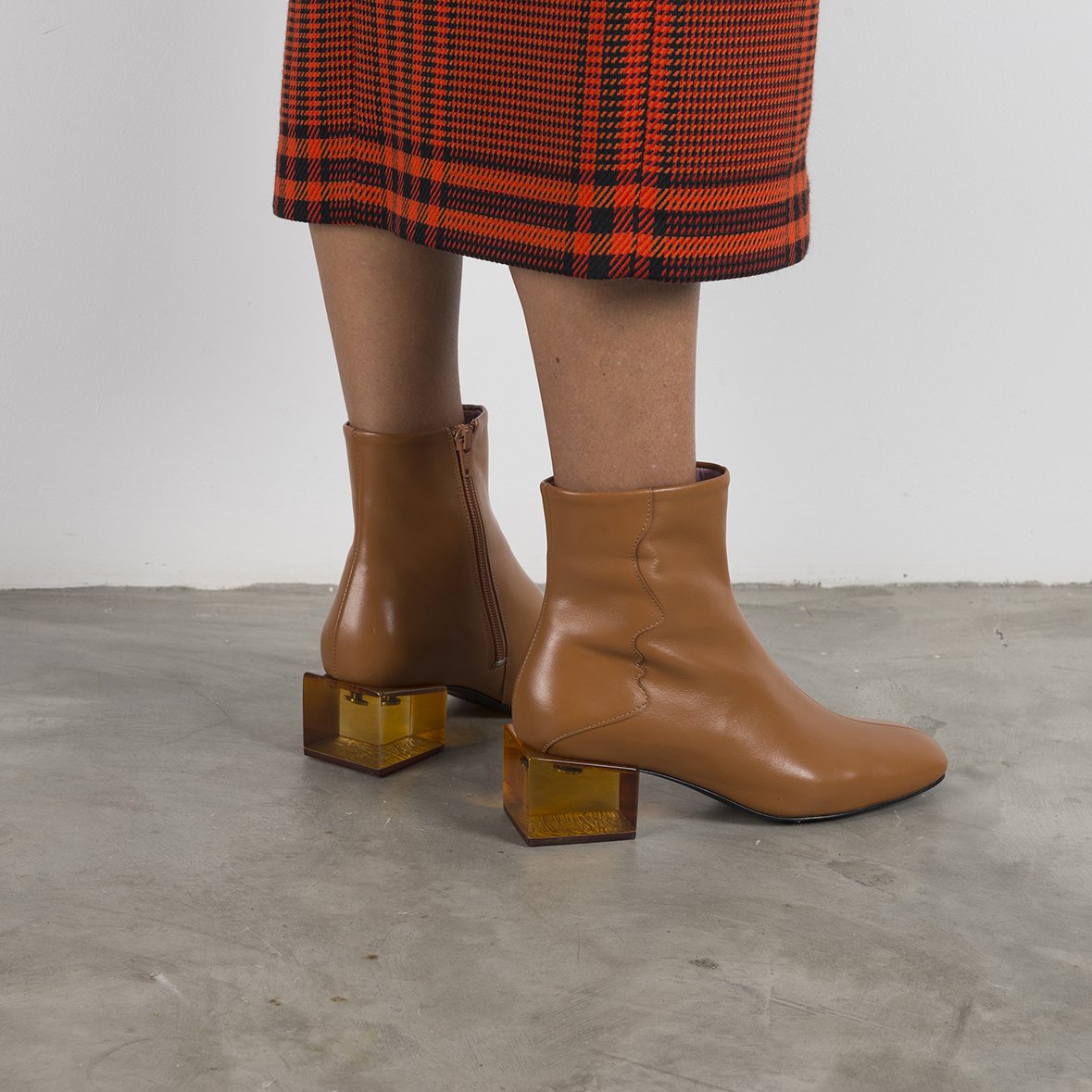 Stylish STATUETTE Camel Leather Boots with acrylic cube heel, showcasing premium craftsmanship and contemporary design.