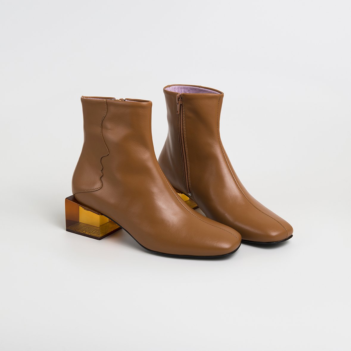 Stylish STATUETTE Camel Leather Boots with acrylic cube heel, showcasing premium craftsmanship and contemporary design.