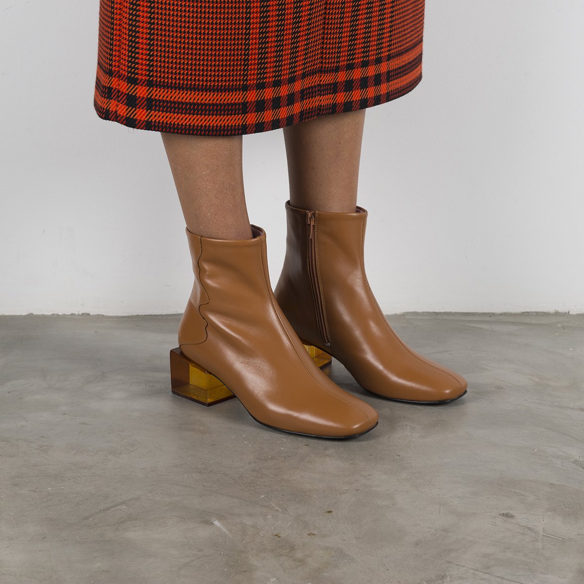 Stylish STATUETTE Camel Leather Boots with acrylic cube heel, showcasing premium craftsmanship and contemporary design.