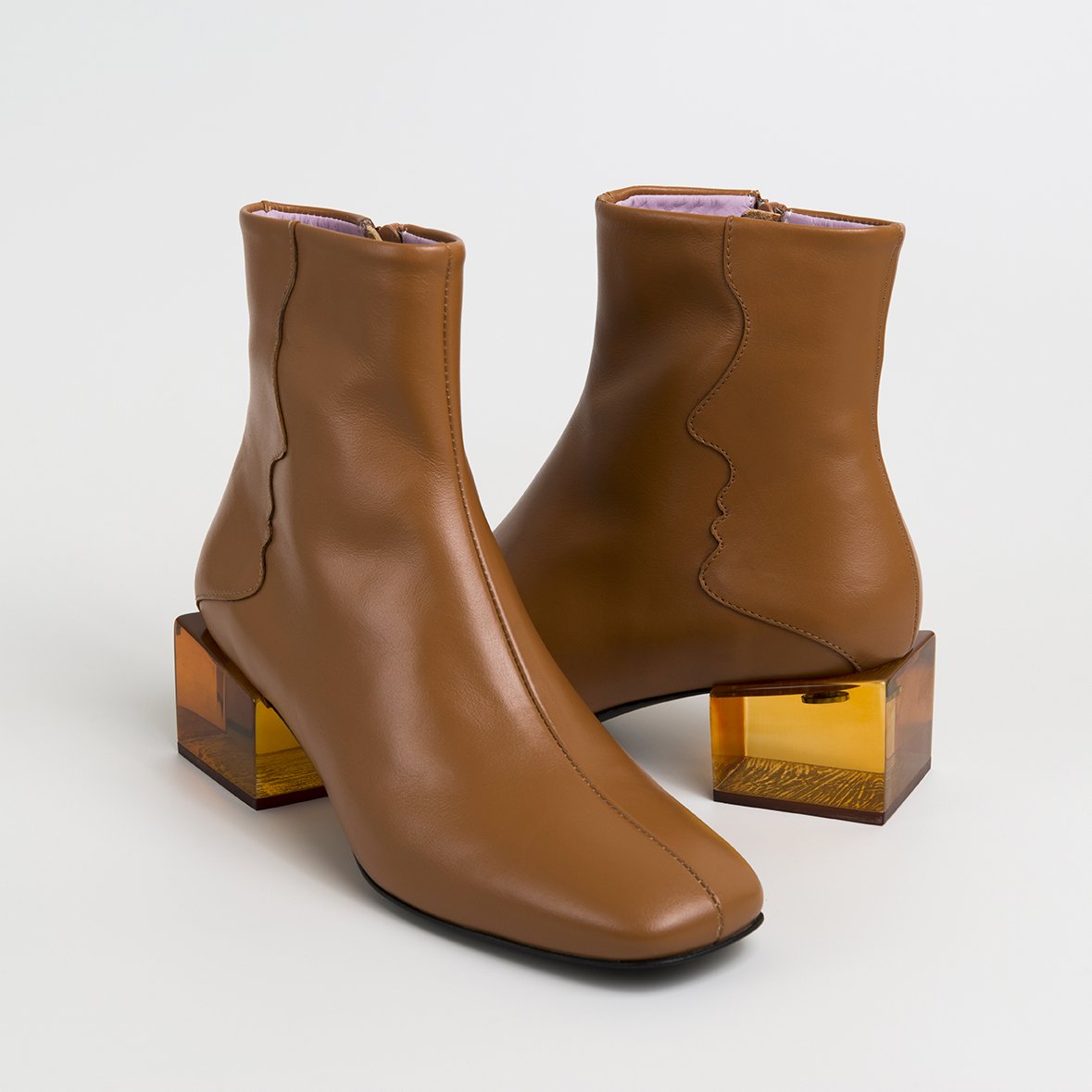 Stylish STATUETTE Camel Leather Boots with acrylic cube heel, showcasing premium craftsmanship and contemporary design.