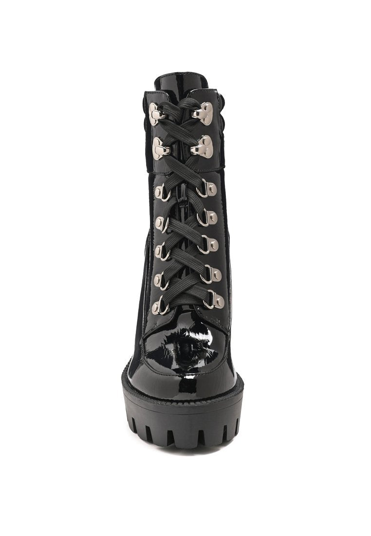 Stylish Stopper Cushion Collared Lace Up Boots with metallic eyelets and high block heel, perfect for parties and casual outings.