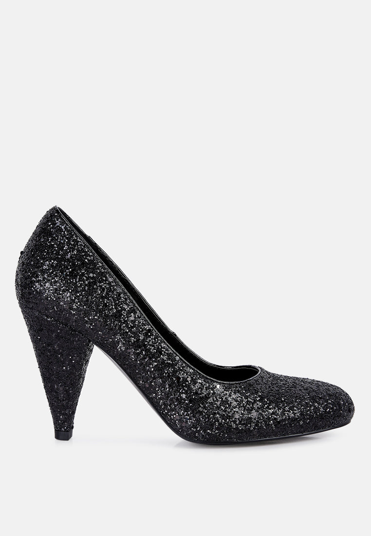 A pair of Sugar Plum Glitter Conical Heel Pumps showcasing a sparkling glitter exterior, conical heels, and a closed toe design, perfect for evening wear.