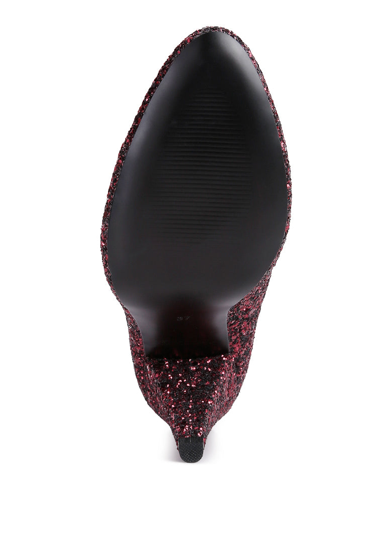 A pair of Sugar Plum Glitter Conical Heel Pumps showcasing a sparkling glitter exterior, conical heels, and a closed toe design, perfect for evening wear.