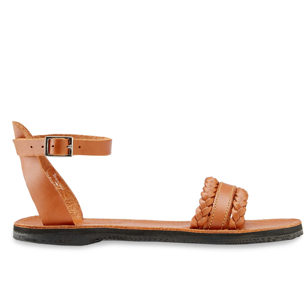 Handmade Bohemia leather sandals featuring braided straps and upcycled tire soles, perfect for bohemian style.