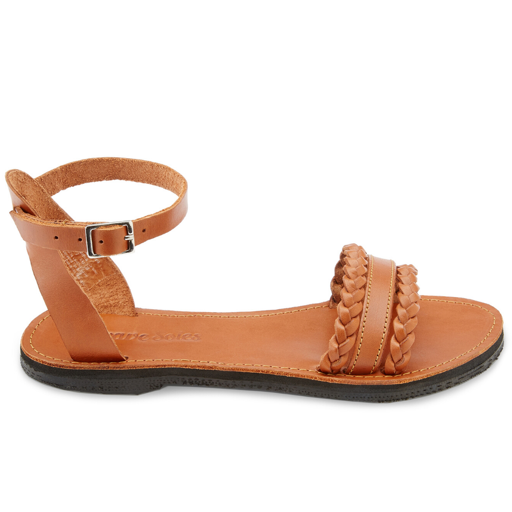 Handmade Bohemia leather sandals featuring braided straps and upcycled tire soles, perfect for bohemian style.