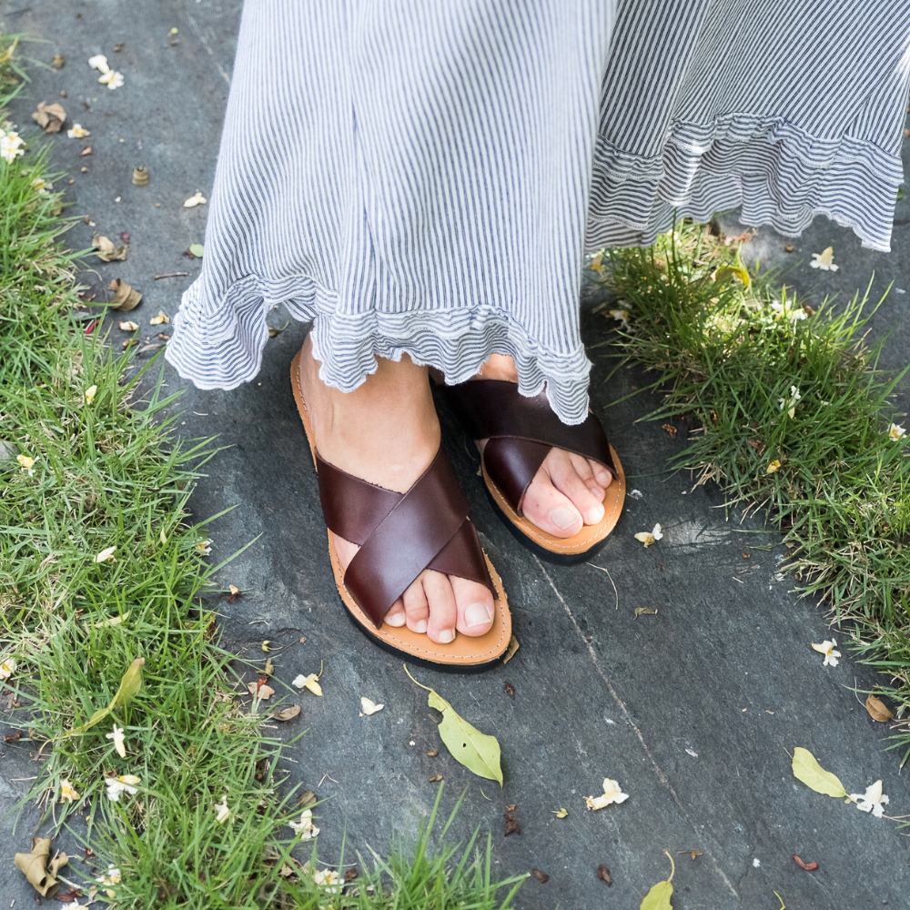 The Constanza genuine leather slides showcasing their stylish design and comfortable fit.