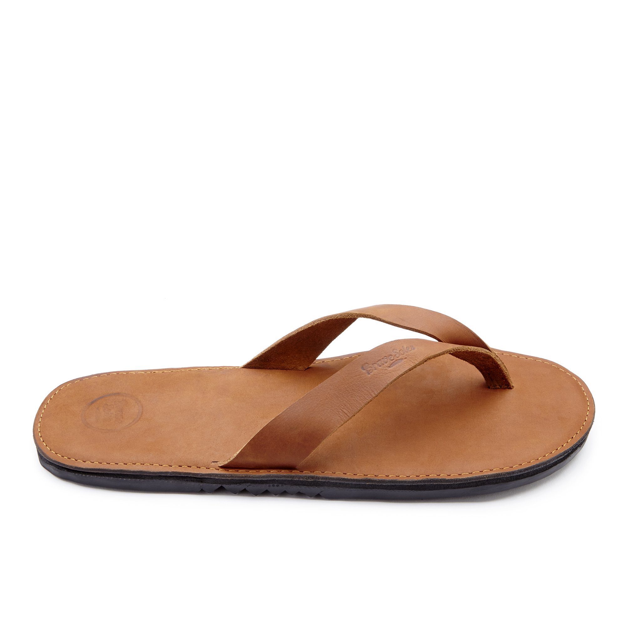 The Novio men's leather flip flops featuring a sleek design with handmade leather footbed and upcycled tire soles.