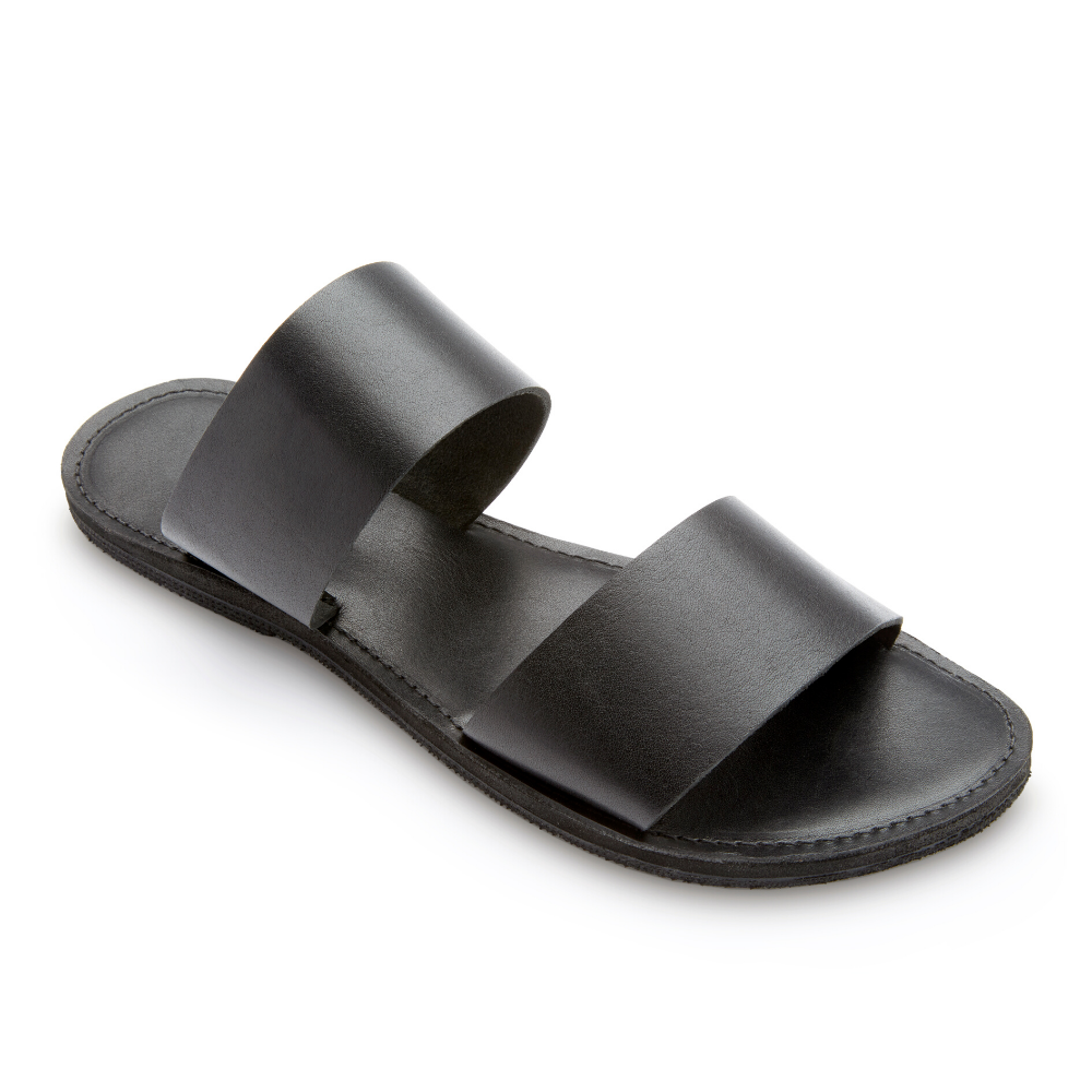 Stylish Ophelia Leather Slide Sandals in black and caramel, featuring minimalist design and eco-friendly upcycled tire soles.