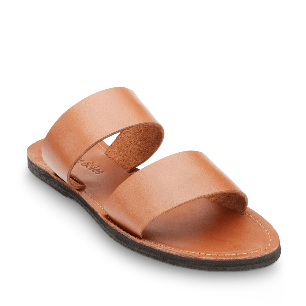 Stylish Ophelia Leather Slide Sandals in black and caramel, featuring minimalist design and eco-friendly upcycled tire soles.