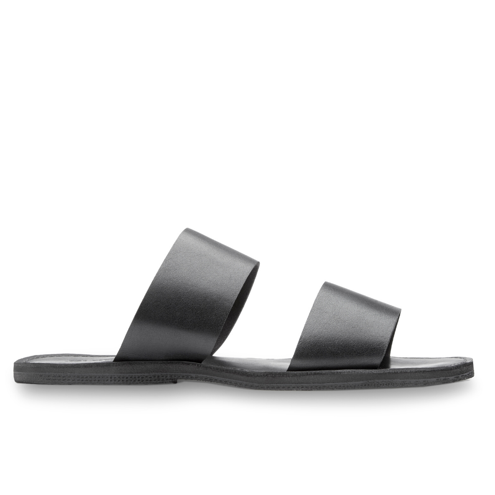 Stylish Ophelia Leather Slide Sandals in black and caramel, featuring minimalist design and eco-friendly upcycled tire soles.