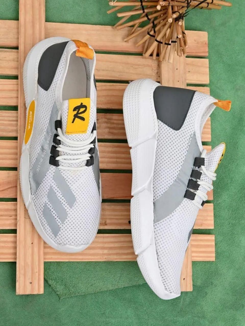 A pair of trendy grey mens casual shoes with lace-up closure, made from synthetic material and featuring a comfortable PVC sole.