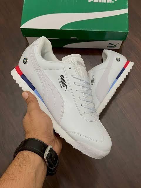 A pair of trendy white mens casual shoes by Puma, featuring a synthetic upper and PVC sole, designed for comfort and style.