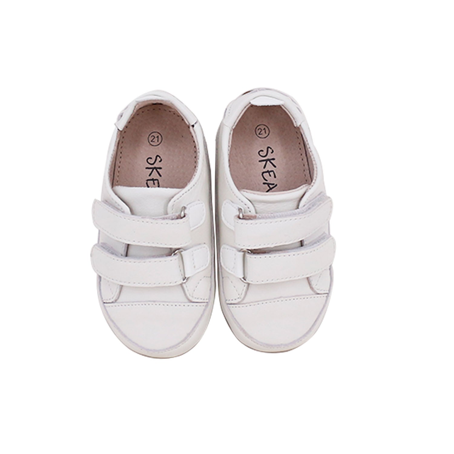 Tyler Trainers First Walker Sneakers in White, made from soft leather with a hook and loop fastener, designed for toddlers.