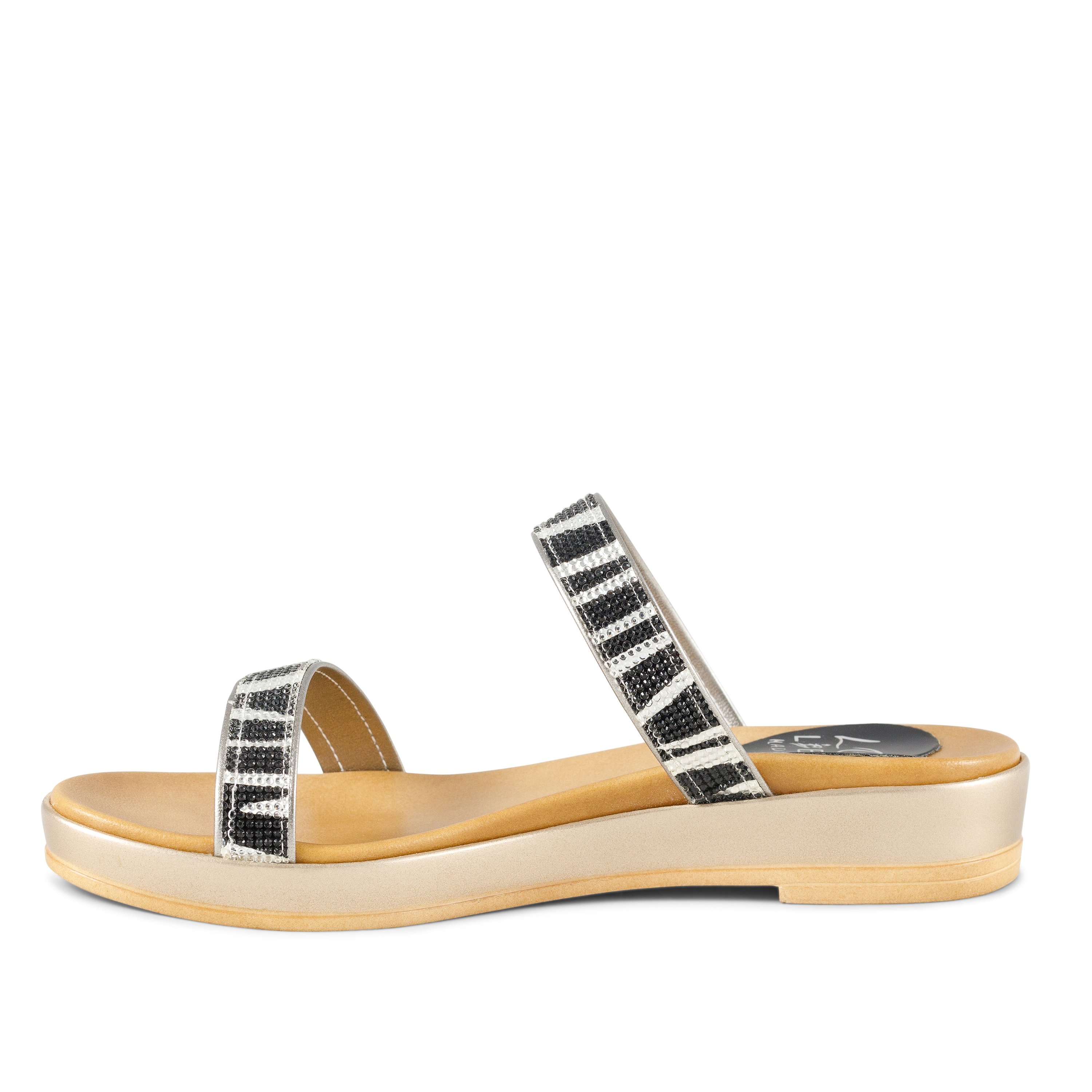 A pair of stylish Untamed sandals featuring a bold zebra print design in black and blue, showcasing rhinestone accents and a comfortable low wedge.