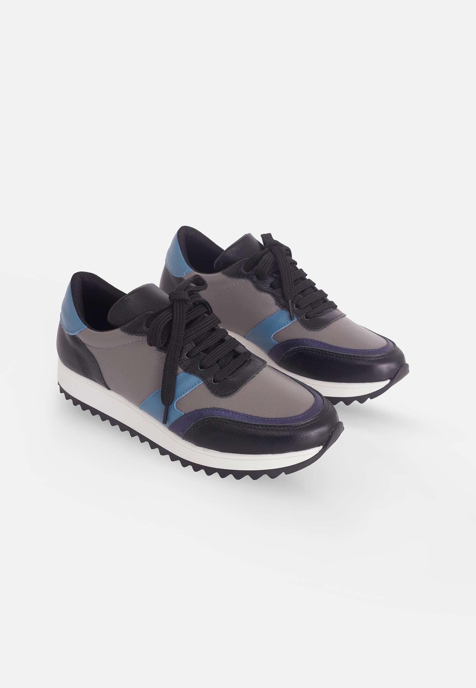 Stylish Mangará Buriri Walking Women's Sneakers in polished leather with grey, blue, and black accents, featuring a low-top silhouette and lace-up design.