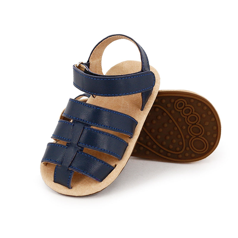 SKEANIE Ziggie First Walker Toddler Sandals in Navy, featuring soft leather uppers and a flexible rubber sole, designed for comfort and support.