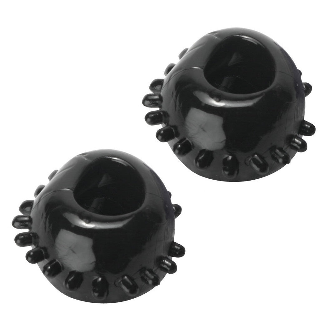 Two black Gummy Cock Rings made of rubber, designed for enhanced pleasure and multiple uses.