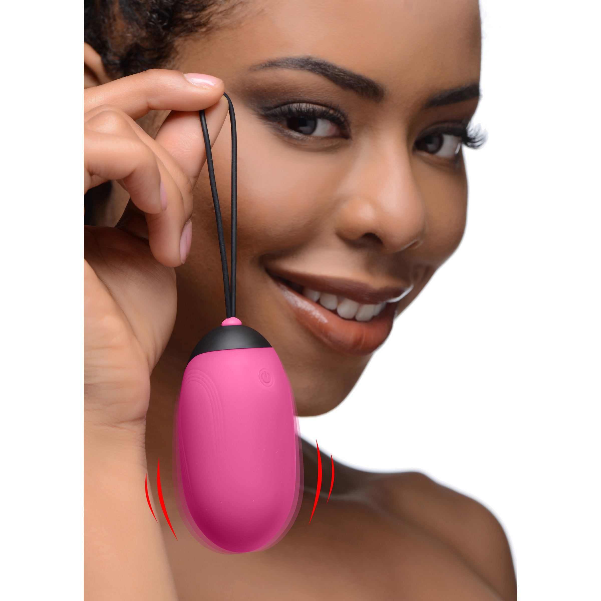 21X XL Silicone Vibrating Egg in pink, showcasing its smooth silicone texture and remote control.