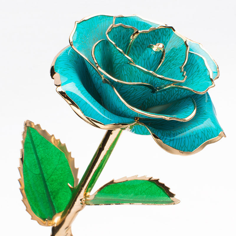 A stunning 24K gold-plated rose flower elegantly displayed in a gift box, symbolizing eternal love and appreciation.