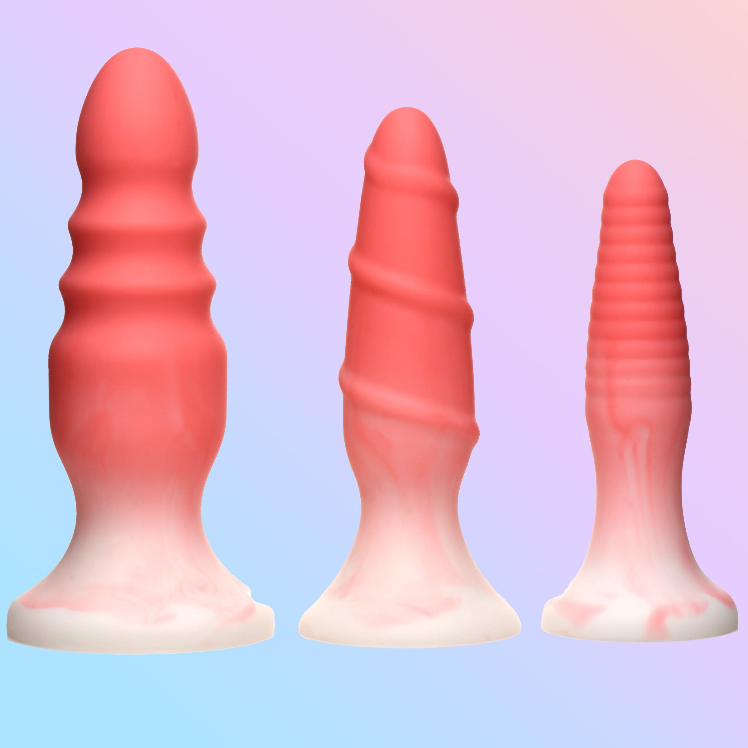 3 Piece Silicone Butt Plug Set in pink, showcasing three graduated sizes with unique textures for enhanced pleasure.