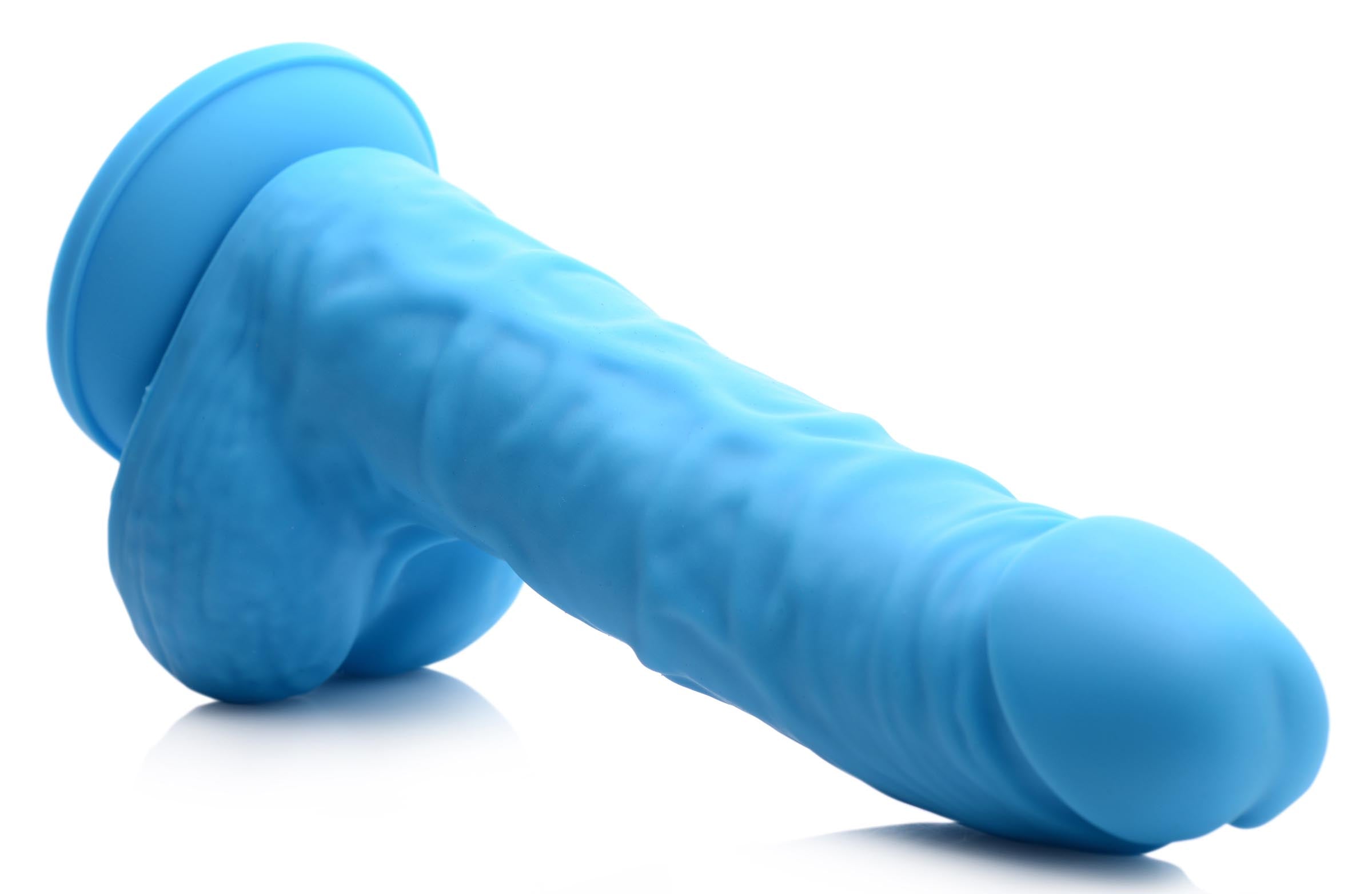 7-inch silicone dildo with realistic veiny design and firm balls in berry color, showcasing its suction cup base for hands-free use.