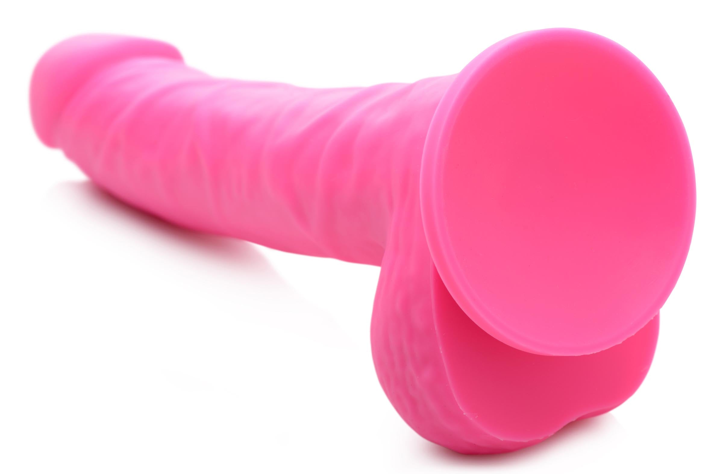 7-inch cherry silicone dildo with realistic veiny design and firm balls, perfect for hands-free use or partnered play.