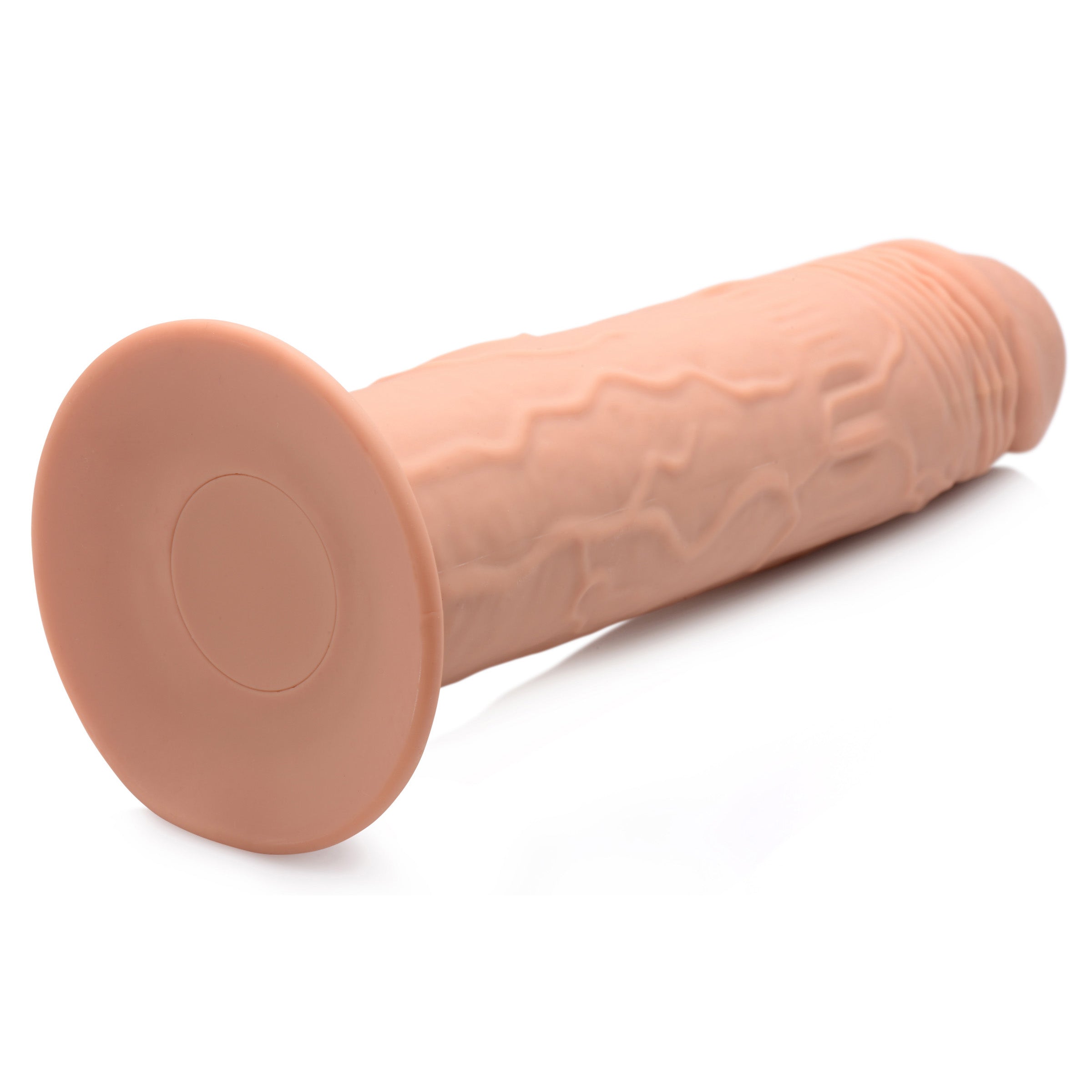 7X Remote Control Vibrating & Thumping Dildo in medium size, showcasing its realistic design and suction cup base.