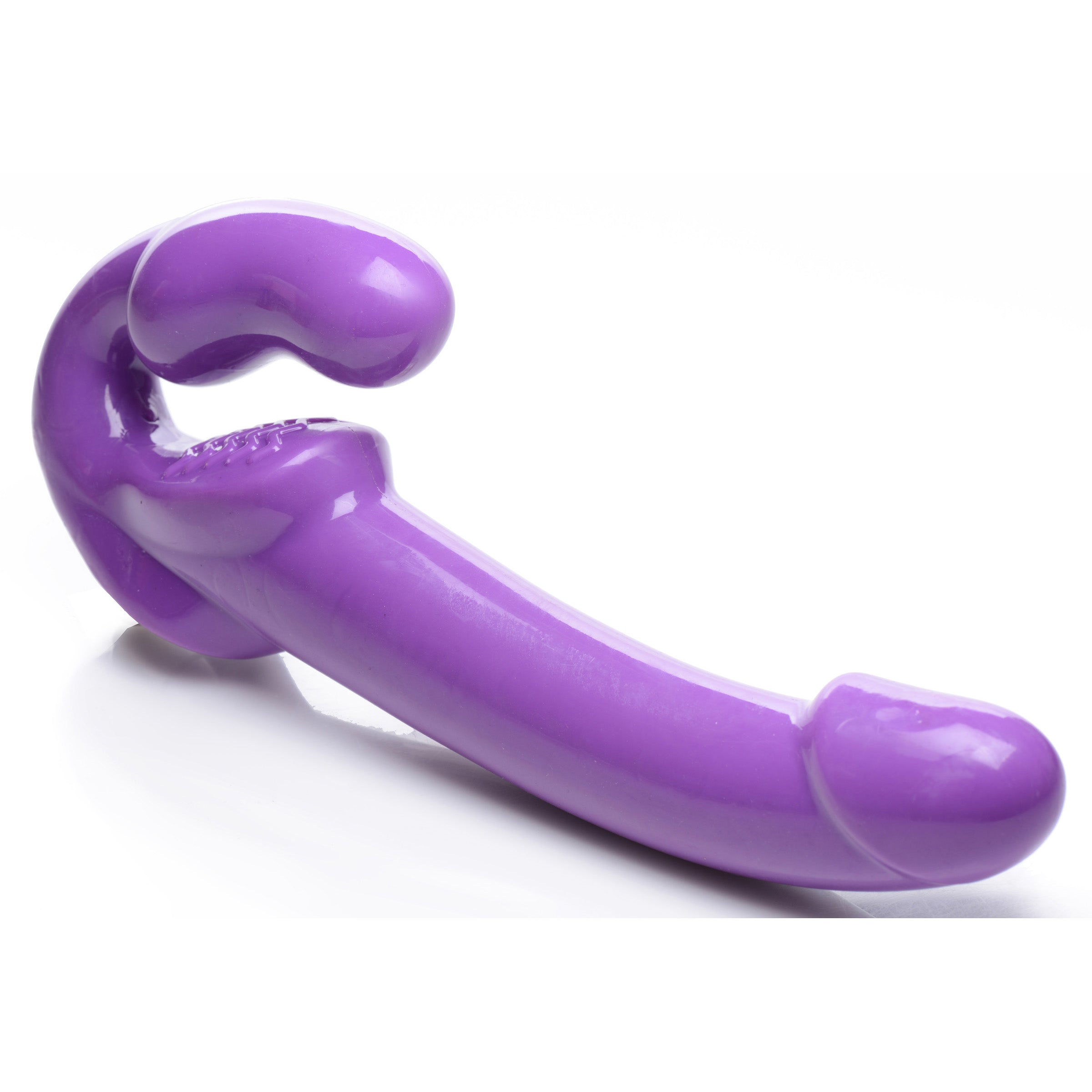 7X Revolver 2 Inch Thick Vibrating Strapless Strap-On in purple, showcasing its long shaft and vaginal bulb design for enhanced pleasure.