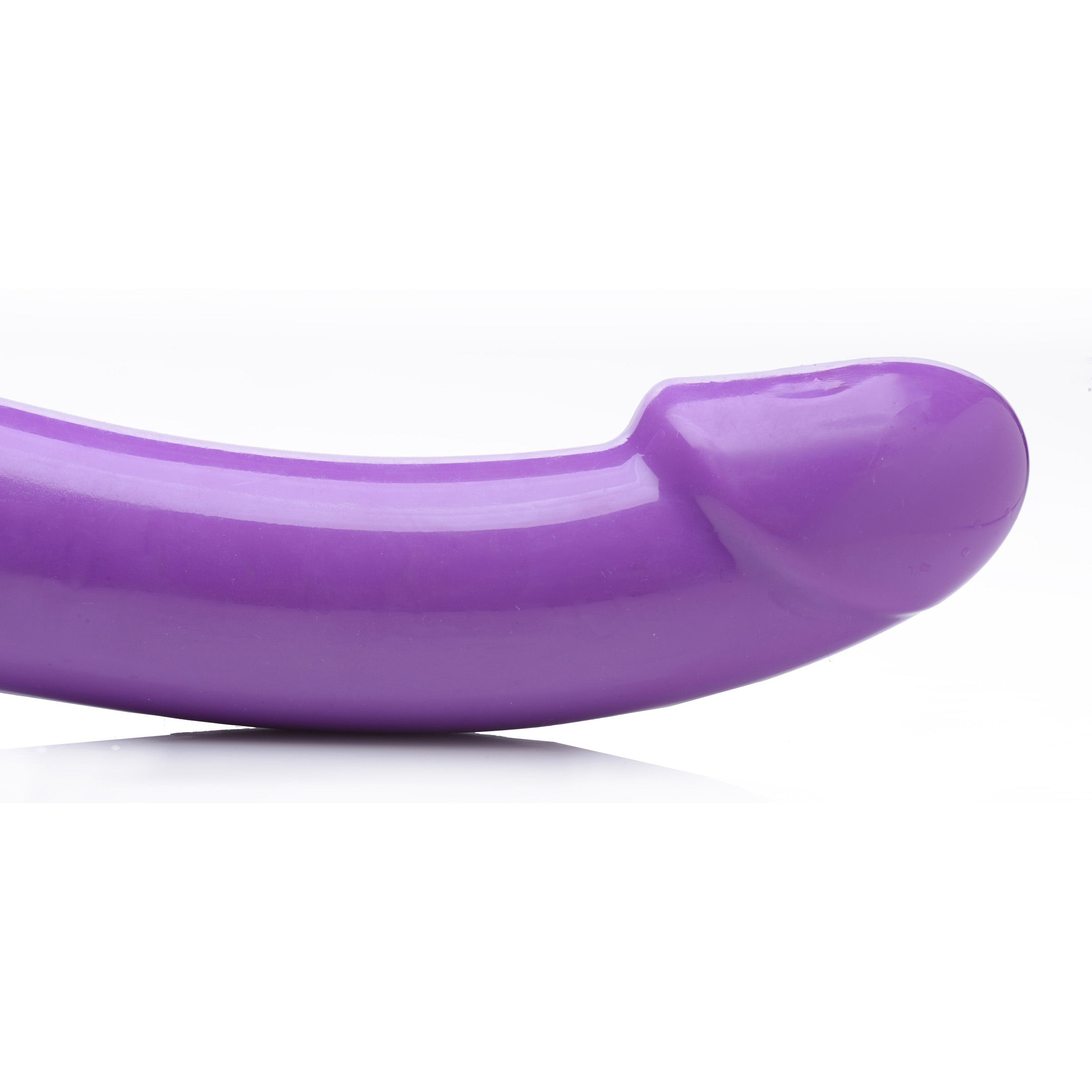 7X Revolver 2 Inch Thick Vibrating Strapless Strap-On in purple, showcasing its long shaft and vaginal bulb design for enhanced pleasure.