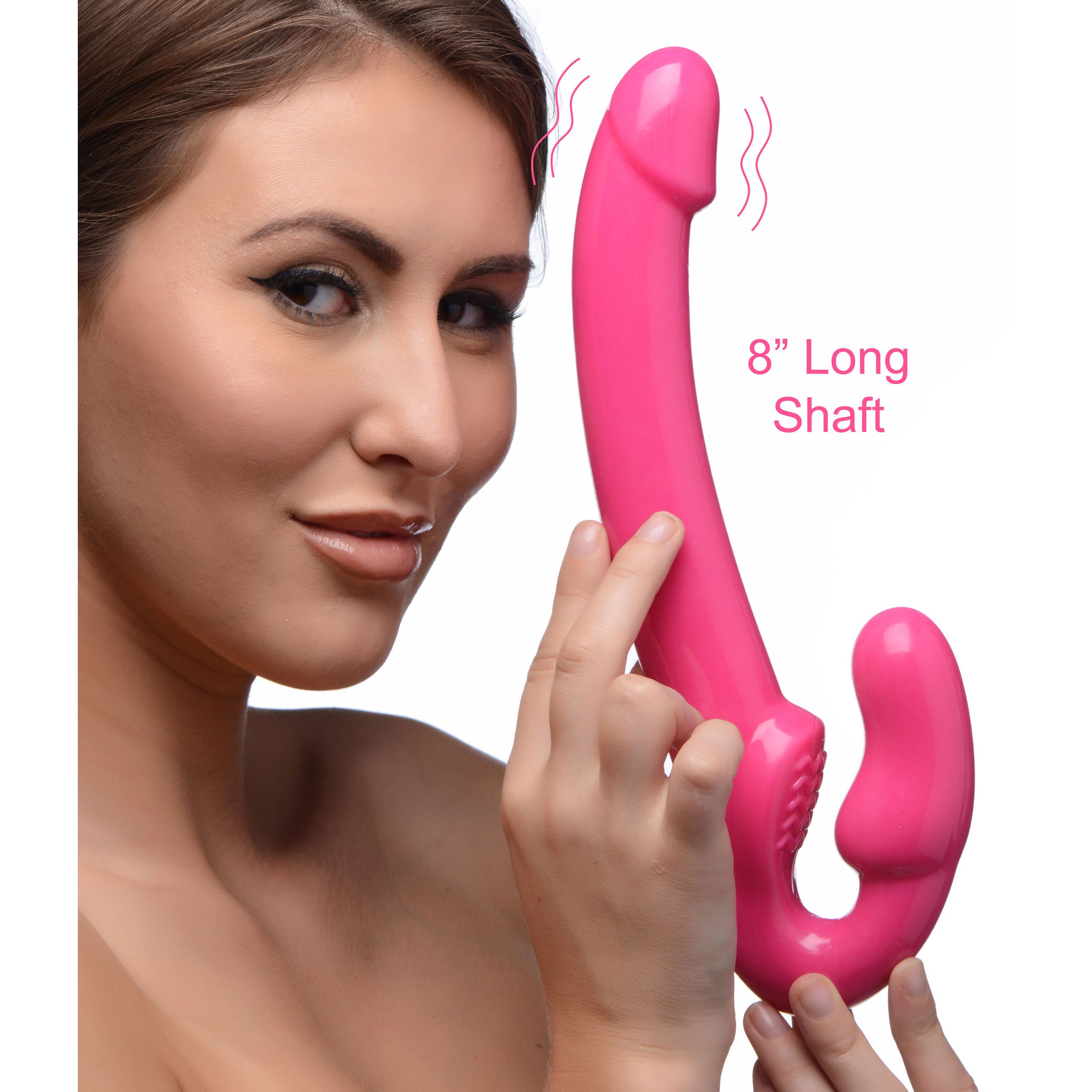 7X Revolver Slim 8 Inch Vibrating Strapless Strap-on in pink, showcasing its long shaft and vaginal bulb for harness-free pleasure.