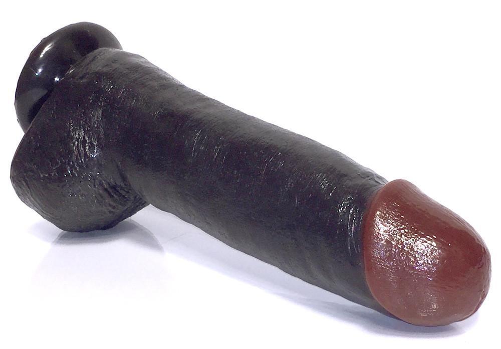 A massive 12-inch Black Balled Dildo with realistic veins and a strong suction cup base, designed for intense pleasure and hands-free fun.