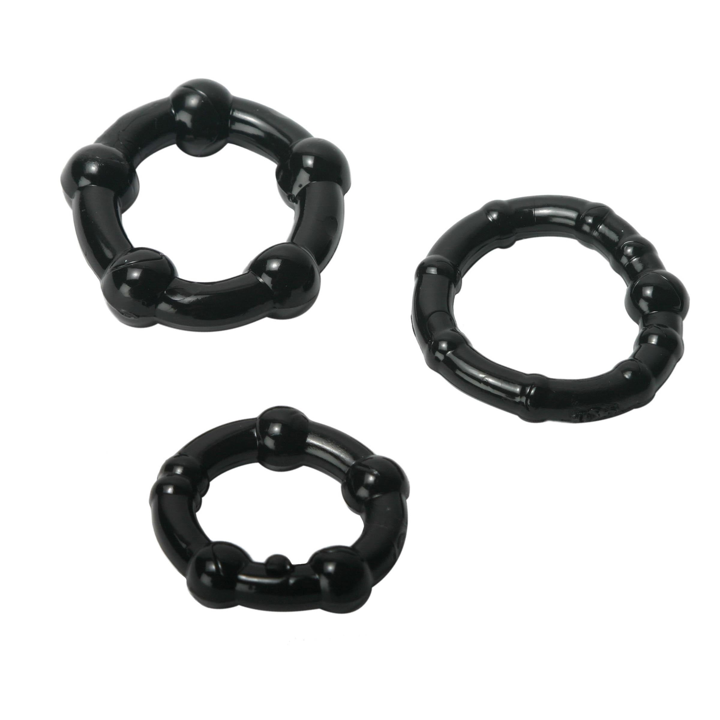 Black Performance Erection Rings in a pack, showcasing different sizes and unique bump patterns for enhanced stimulation.