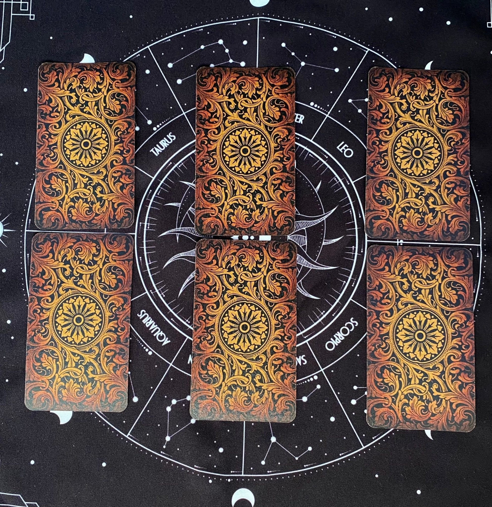 A luxurious black tarot cloth measuring 18x18 inches, designed for tarot card spreads, featuring a unique copyrighted design.