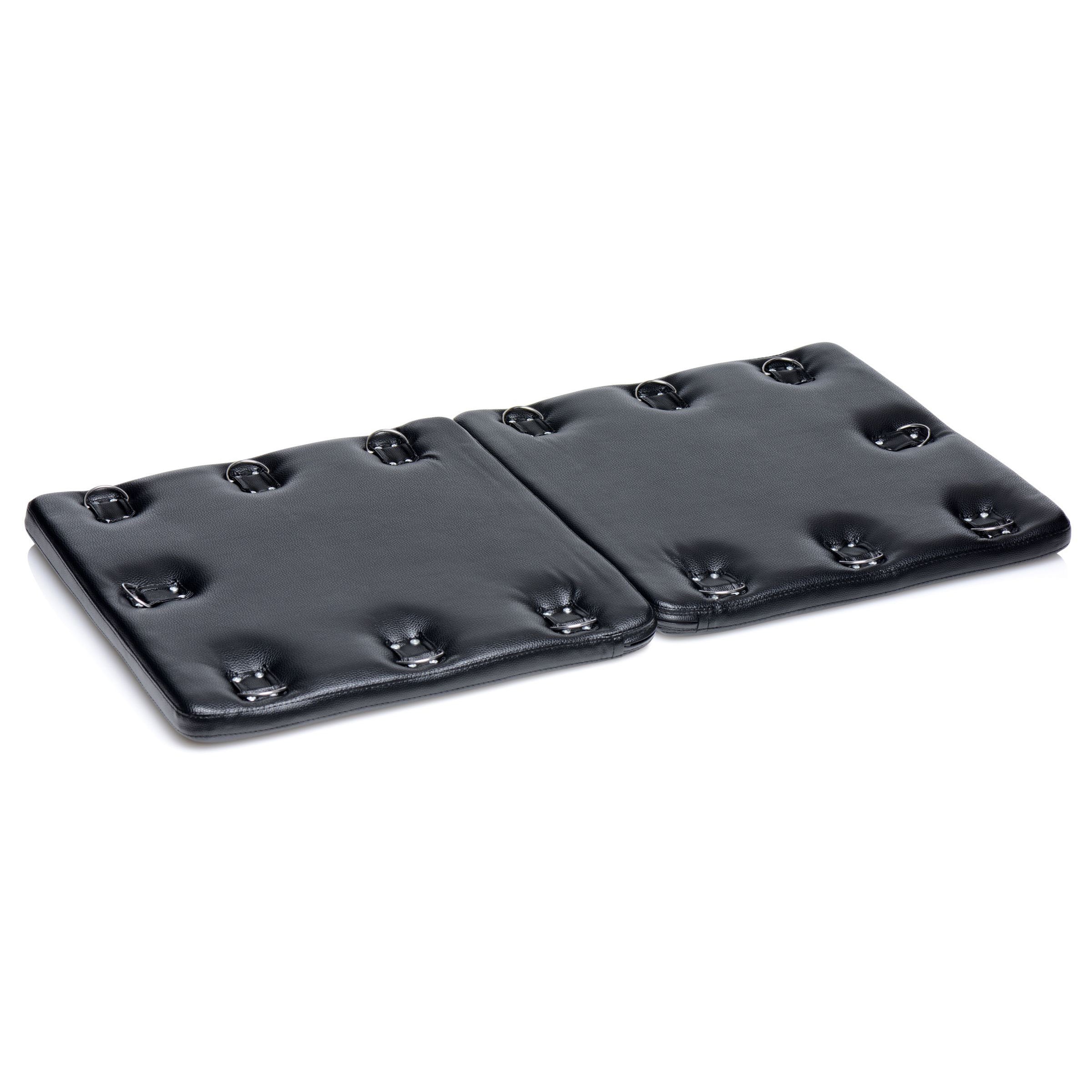 A black Bondage Board with 14 D-ring attachment points, padded for comfort, designed for BDSM play.