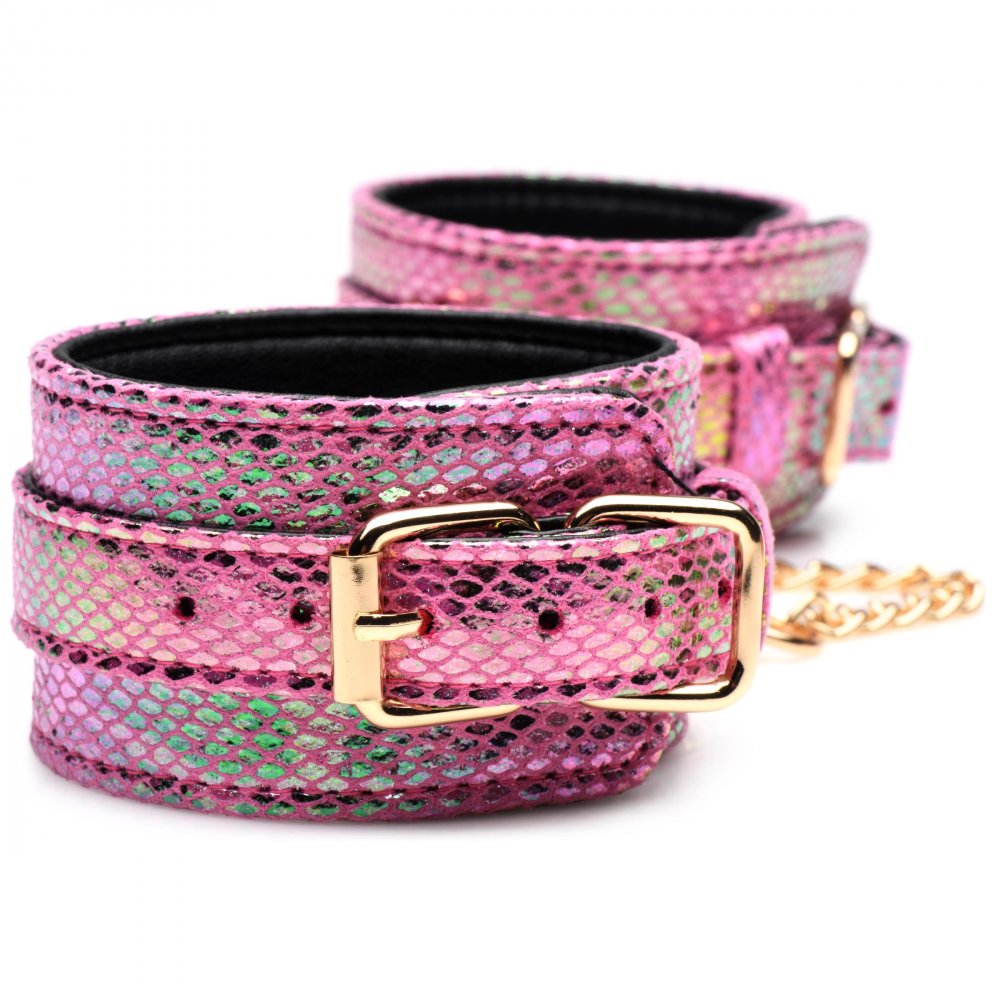 Captive Cobra 6 Piece Bondage Set featuring pink cuffs, collar, and leash with iridescent rainbow shine and golden metal accents.