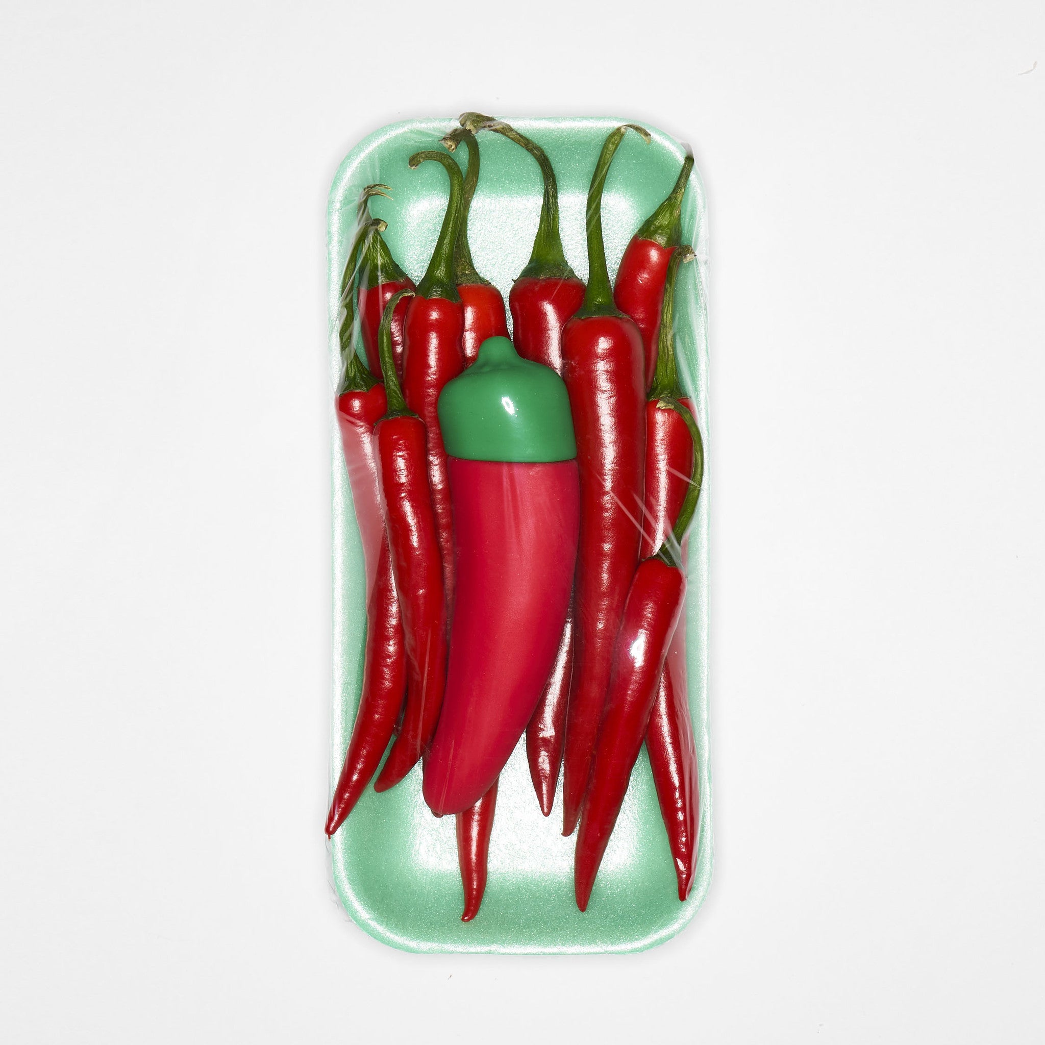 Chili Pepper Emojibator, a vibrant red silicone vibrator shaped like a chili pepper, featuring a bendy tip and buttons for vibration settings.