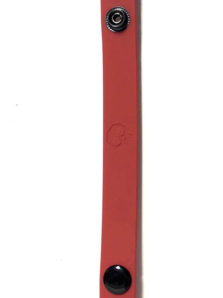 Cock Strap Red made of soft touch silicone, featuring multiple snap sizing options for a comfortable fit, ideal for enhancing intimate experiences.