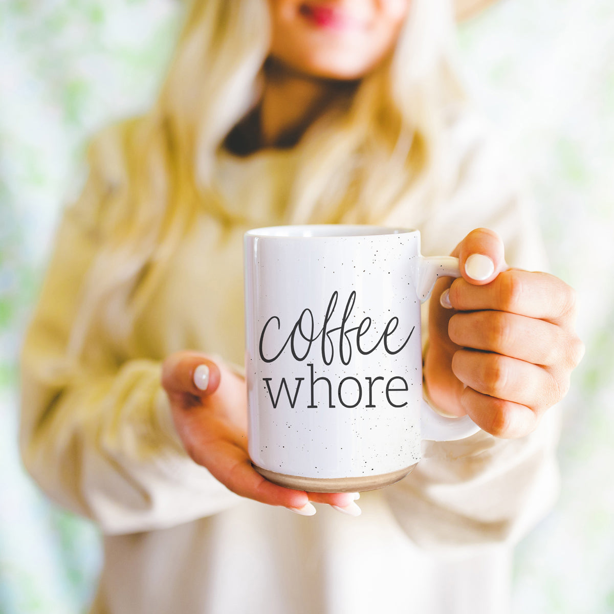 Coffee Whore Ceramic Mug with humorous graphic, off-white color with dark speckles, perfect for coffee lovers.