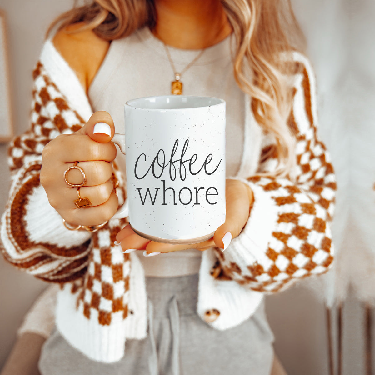 Coffee Whore Ceramic Mug with humorous graphic, off-white color with dark speckles, perfect for coffee lovers.