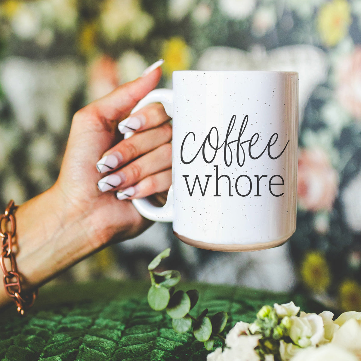 Coffee Whore Ceramic Mug with humorous graphic, off-white color with dark speckles, perfect for coffee lovers.