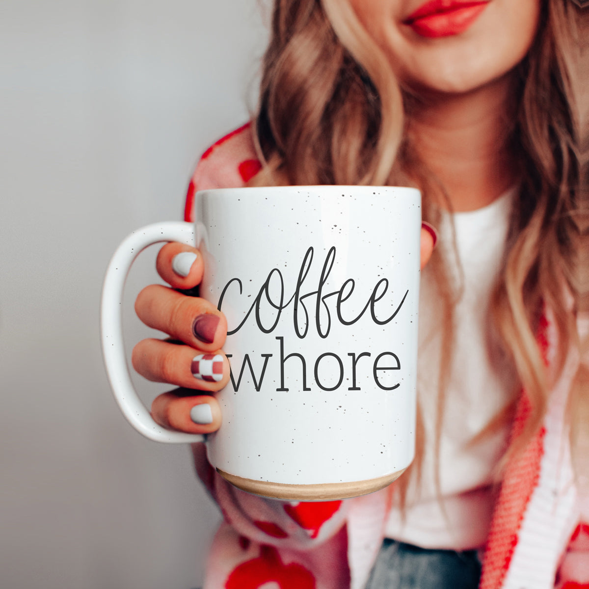 Coffee Whore Ceramic Mug with humorous graphic, off-white color with dark speckles, perfect for coffee lovers.