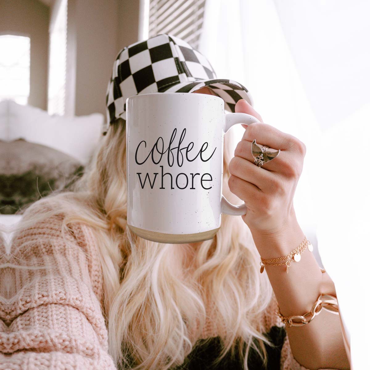 Coffee Whore Ceramic Mug with humorous graphic, off-white color with dark speckles, perfect for coffee lovers.