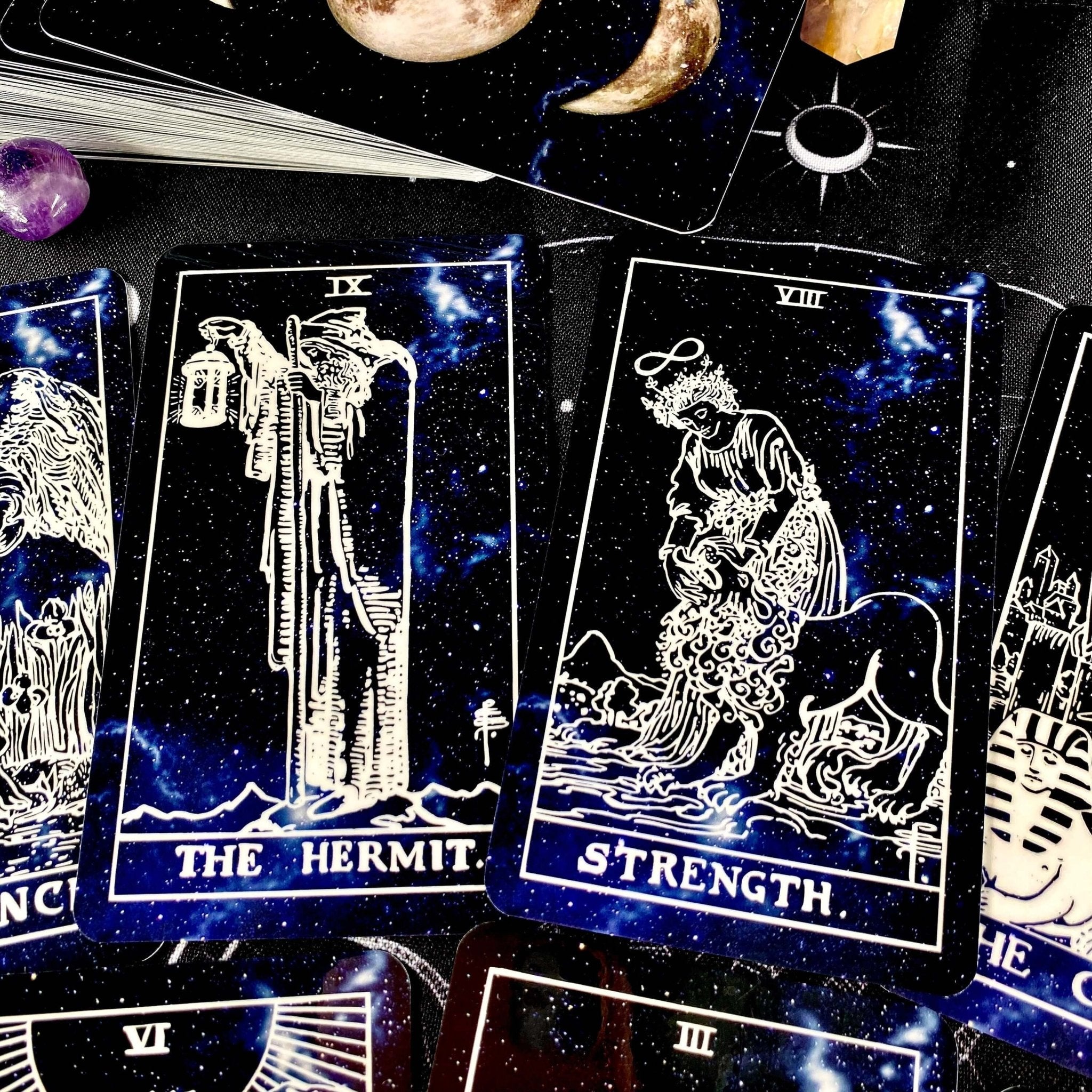 Deep Space Tarot Deck featuring cosmic designs, vibrant colors, and a guidebook, perfect for tarot readings.