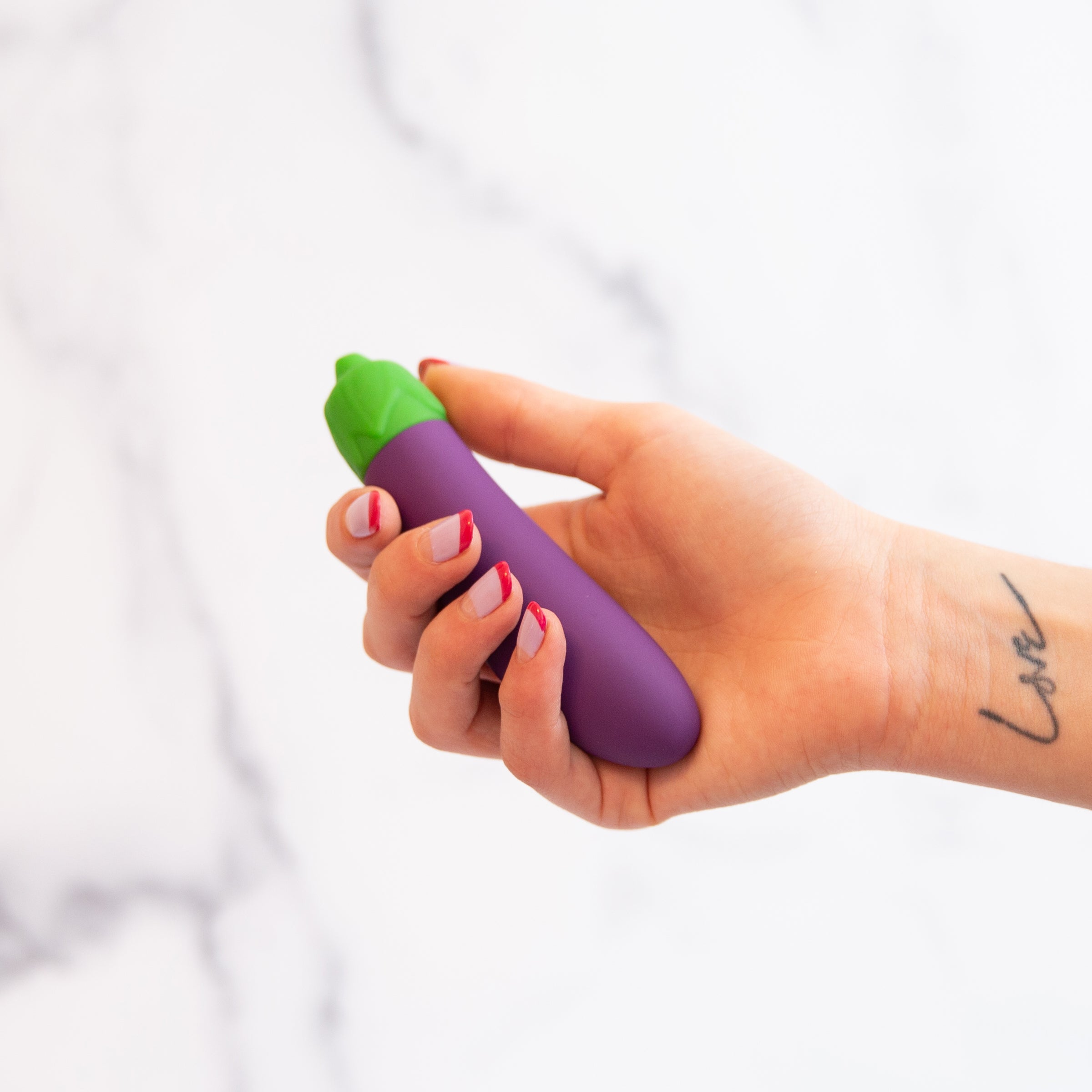 A vibrant purple eggplant-shaped vibrator with a sleek design, showcasing its 10 vibration settings and waterproof features.