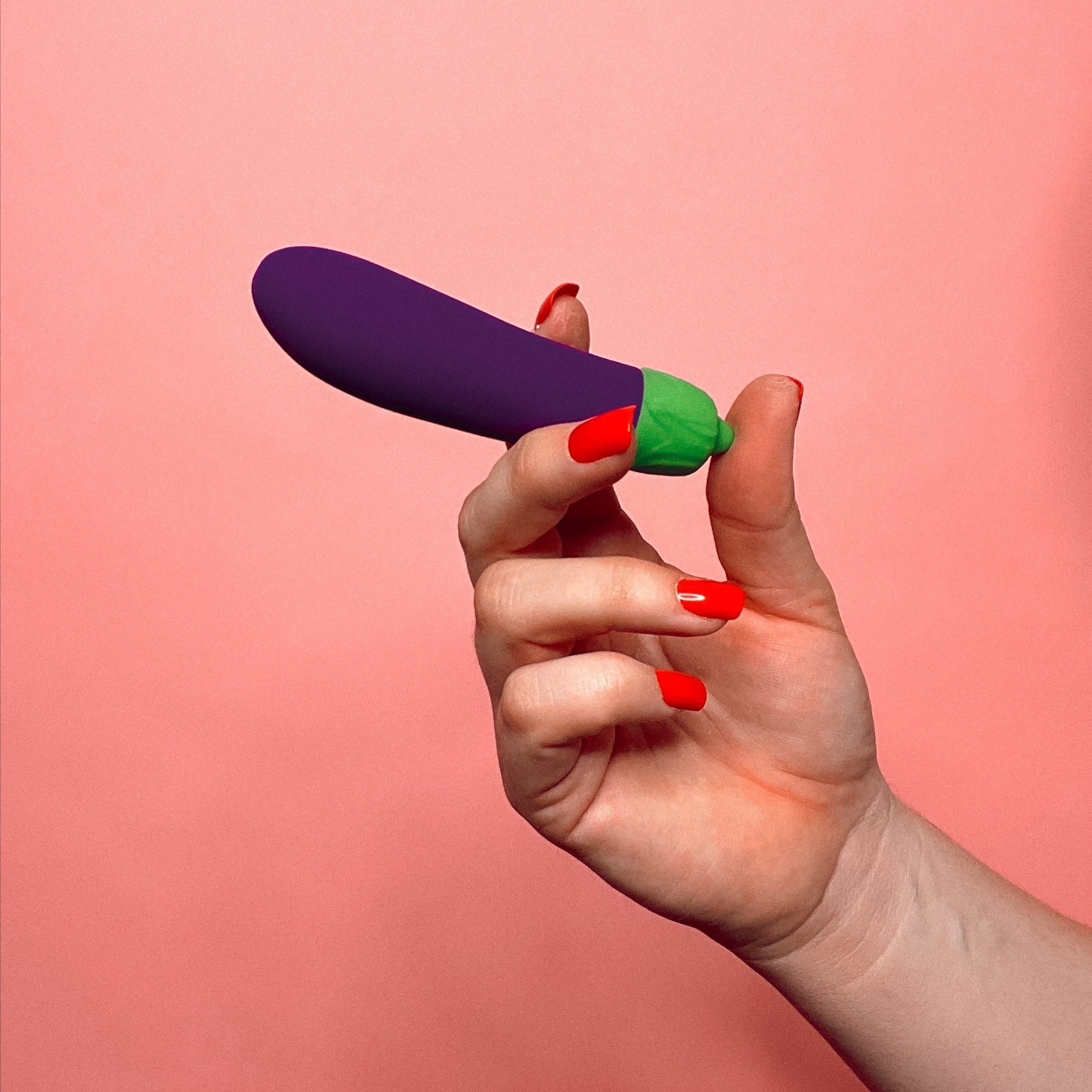 A vibrant purple eggplant-shaped vibrator with a sleek design, showcasing its 10 vibration settings and waterproof features.