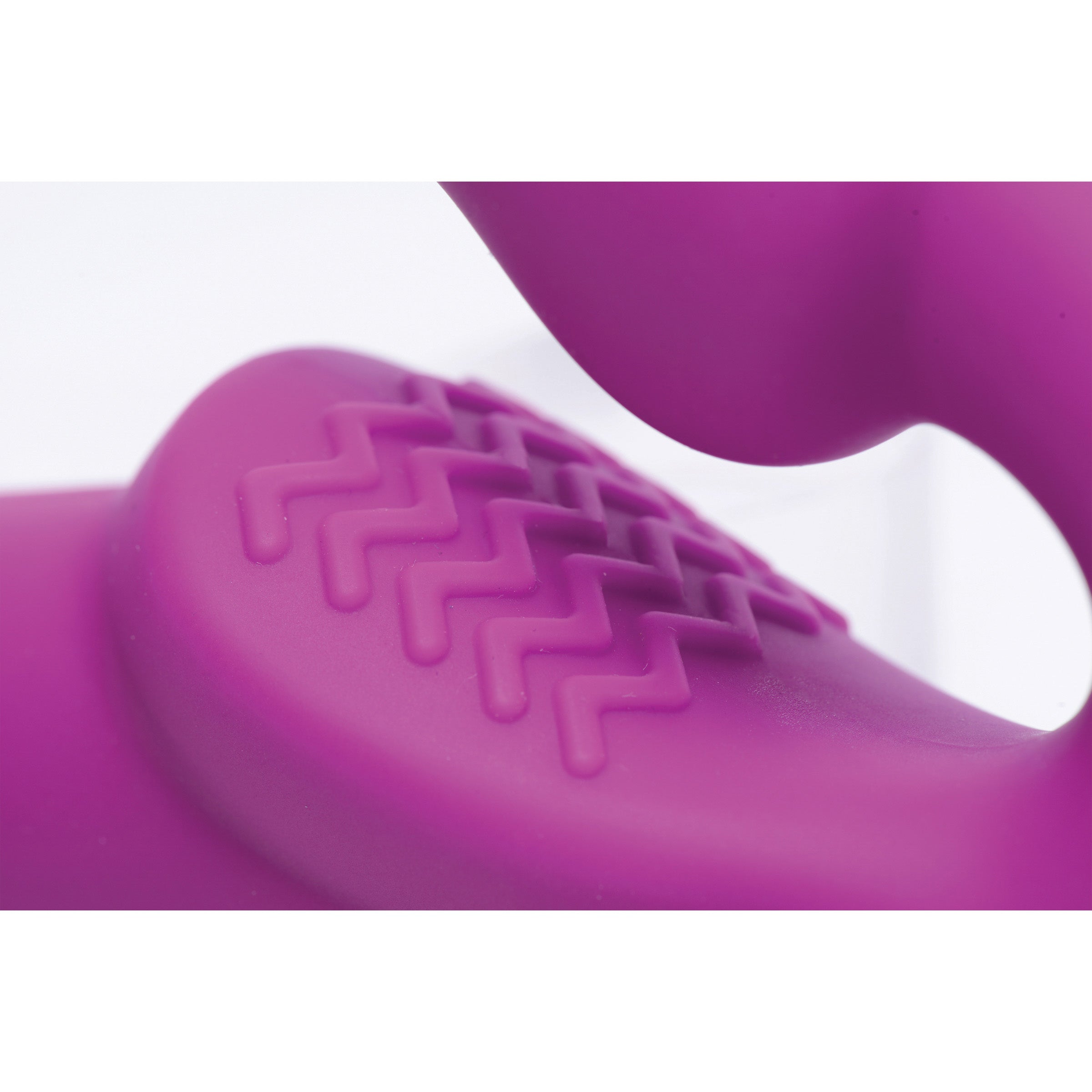 Evoke Vibrating Strapless Silicone Strap-on Dildo in pink, showcasing its curved design and smooth silicone finish.