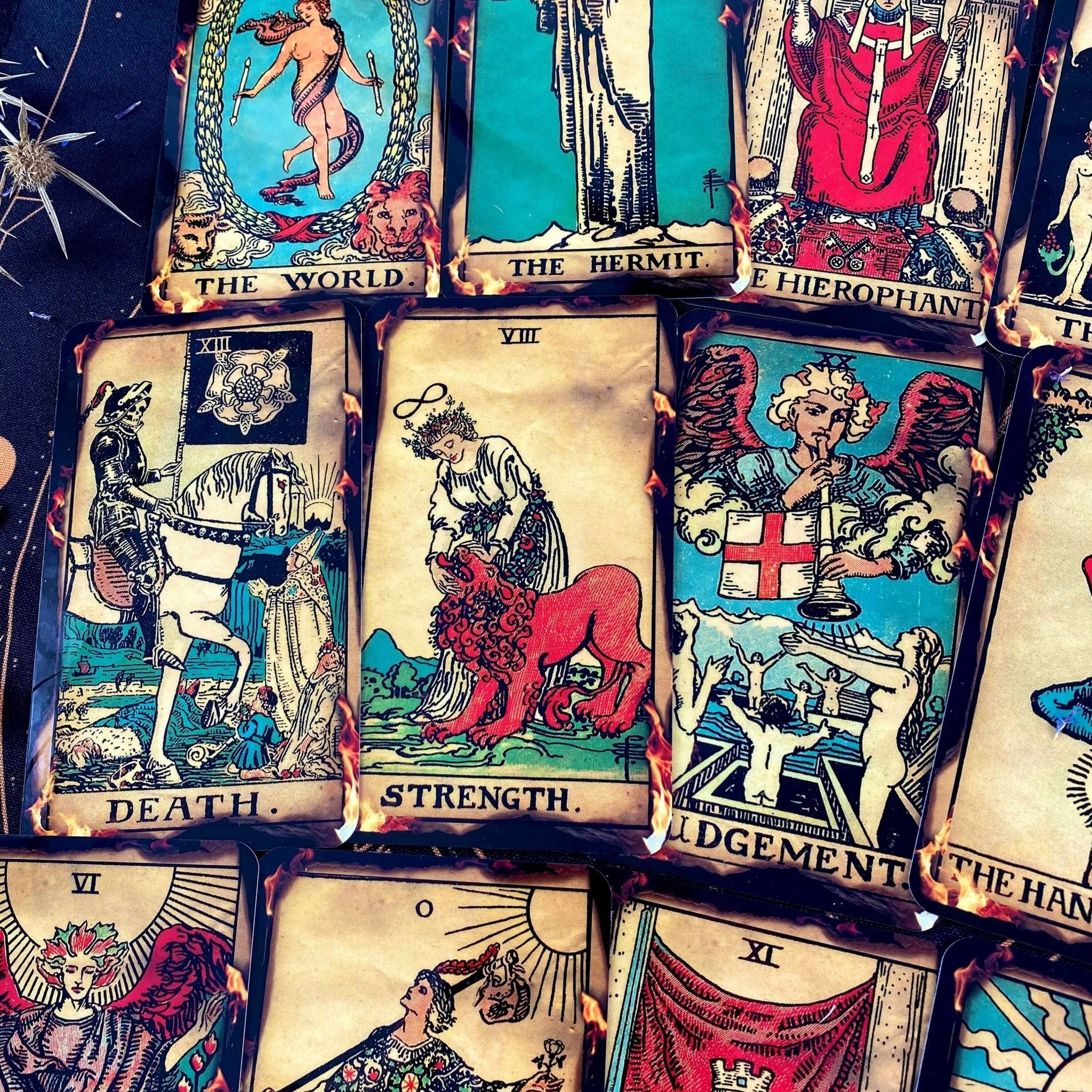 Fire Tarot Deck featuring 78 beautifully illustrated cards, a guidebook, velvet bag, and wooden box, perfect for tarot readings.