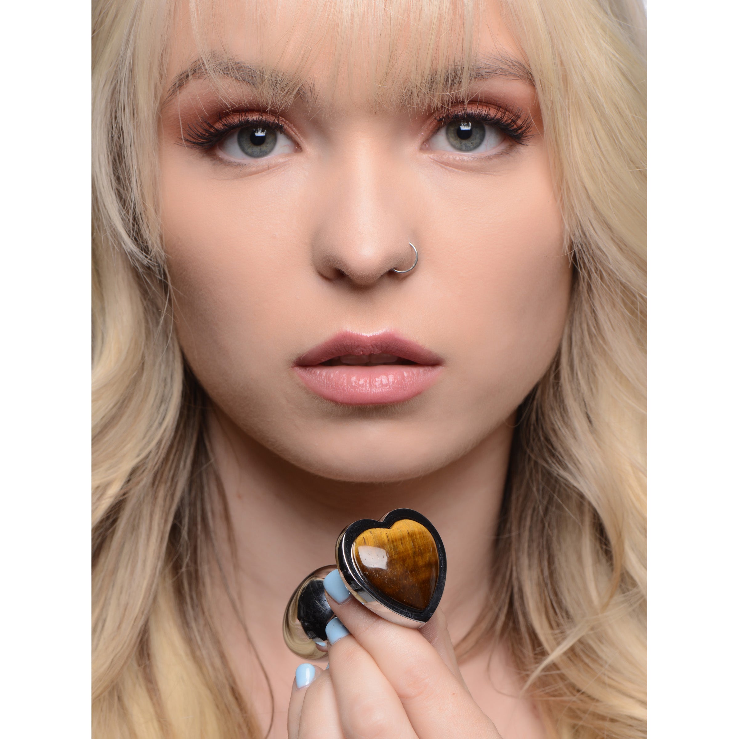 A medium-sized heart-shaped anal plug made of genuine Tiger's Eye gemstone and nickel-free aluminum alloy, showcasing its smooth surface and elegant design.