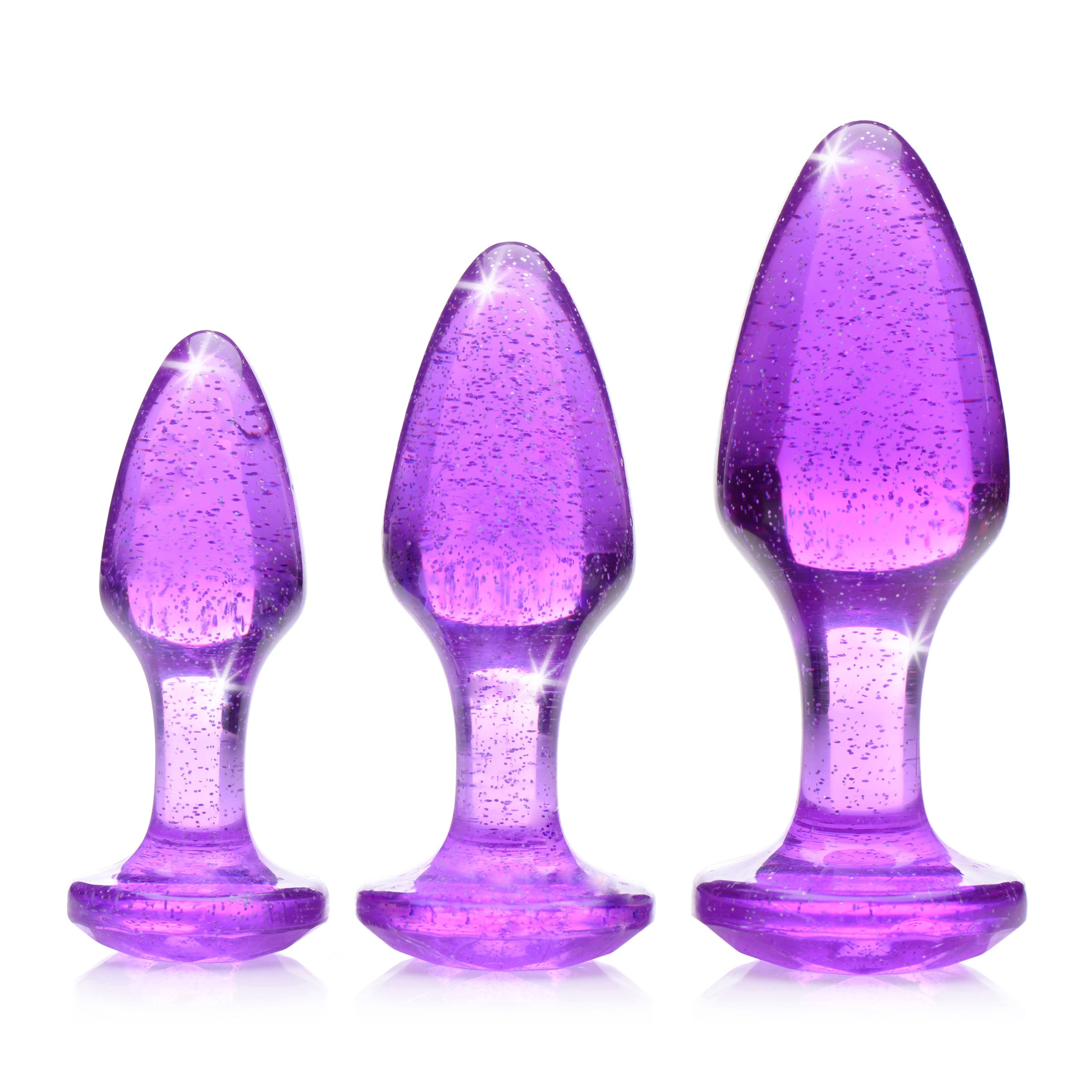 Glitter Gem Anal Plug Set in purple with three graduated sizes, featuring a shiny glittery pattern for enhanced anal play.