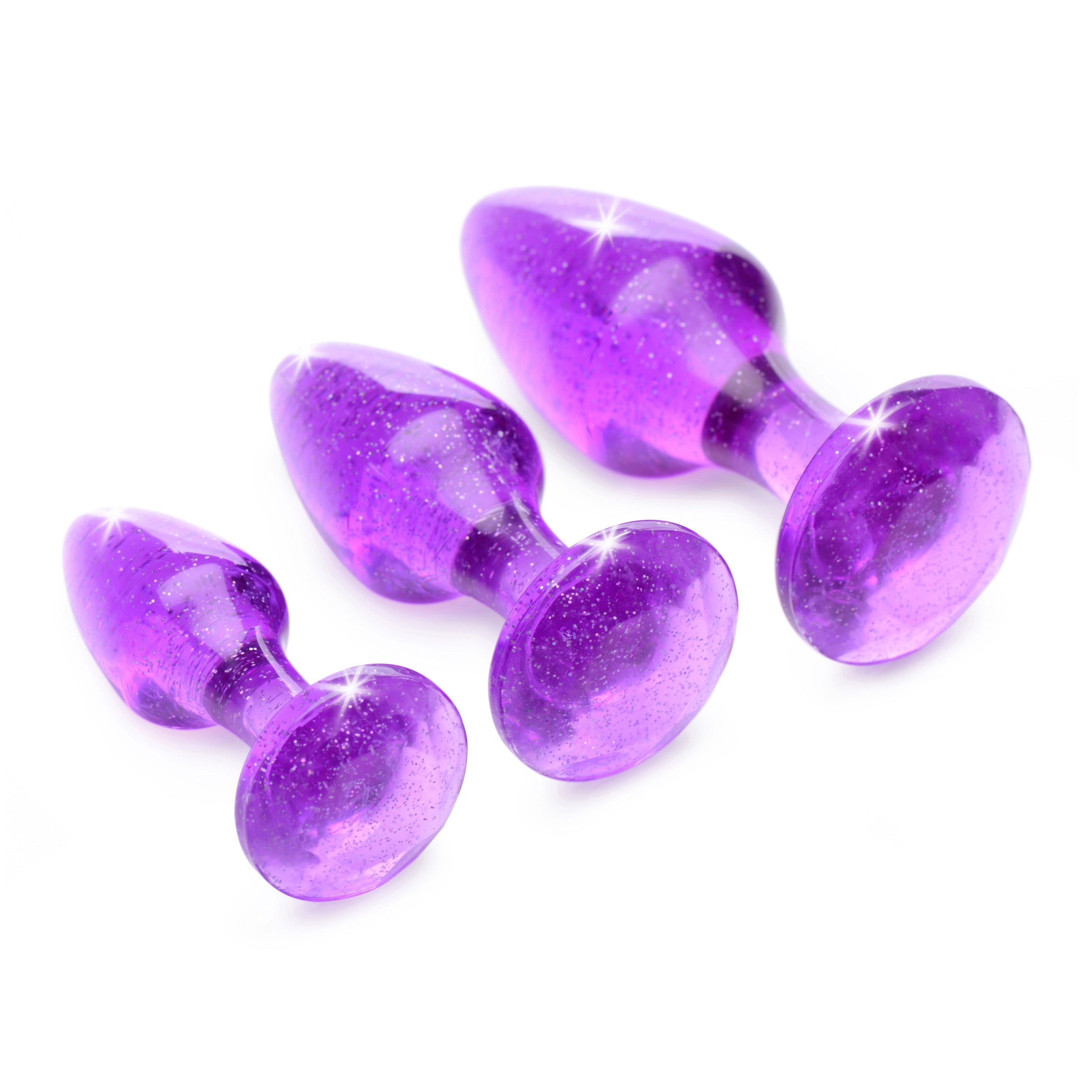 Glitter Gem Anal Plug Set in purple with three graduated sizes, featuring a shiny glittery pattern for enhanced anal play.